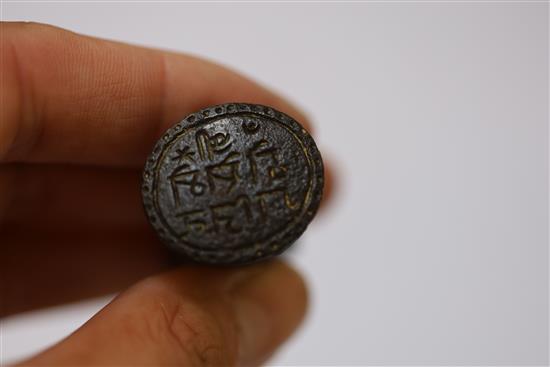 A Tibetan bronze seal, antique copper torq and an Egyptian scarab